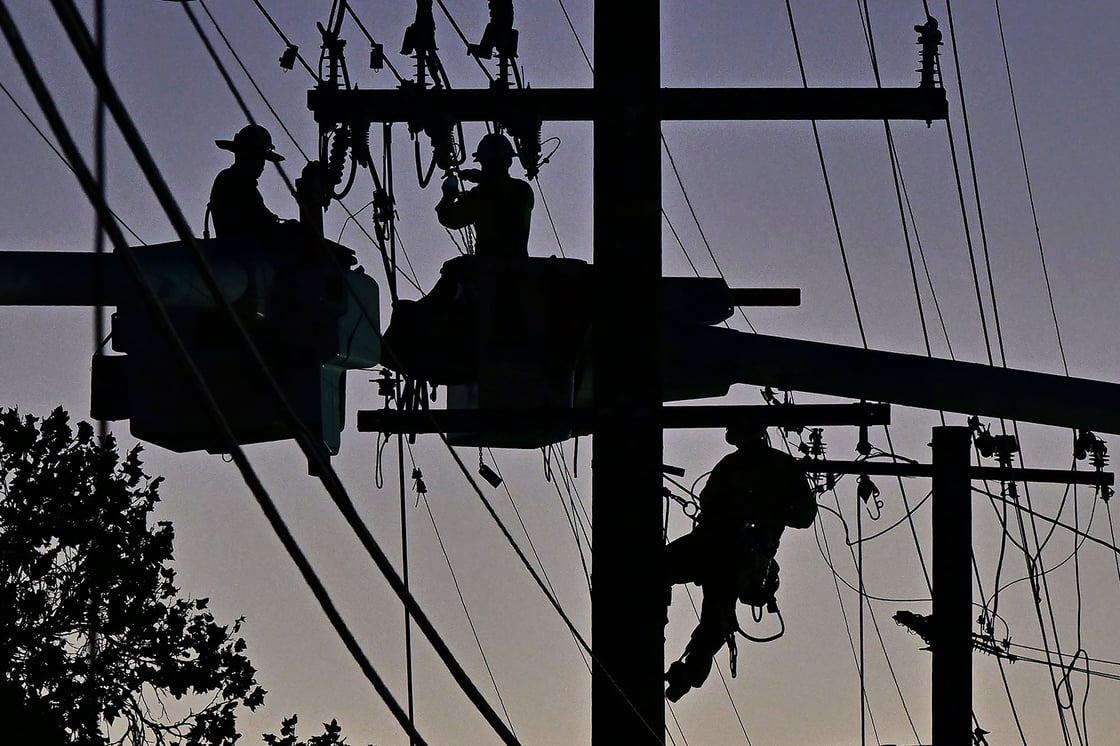 Workers replace power lines in Monterey Park, California, on October 6, 2023. (Getty/Frederic J. Brown)