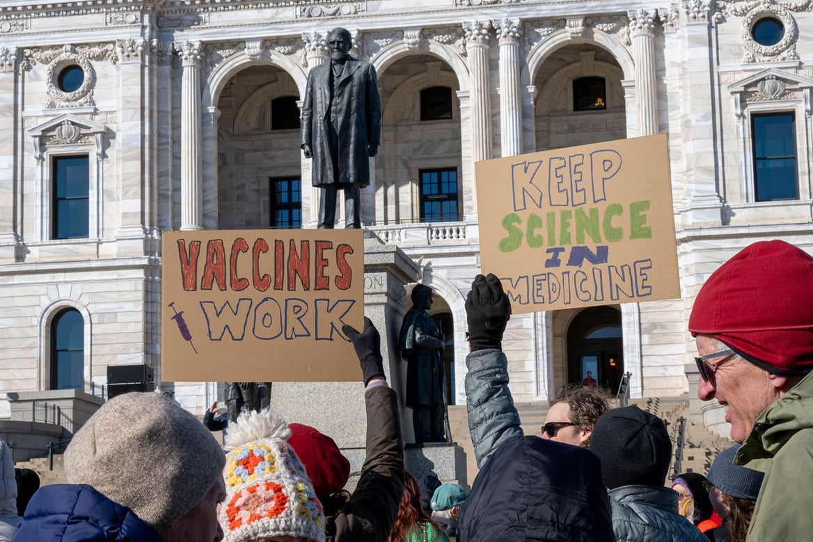 Signs are seen at the “Stand Up for Science” rally at the St. Paul, Minnesota, State Capitol building. (Getty/ Michael Siluk/UCG/Universal Images Group)