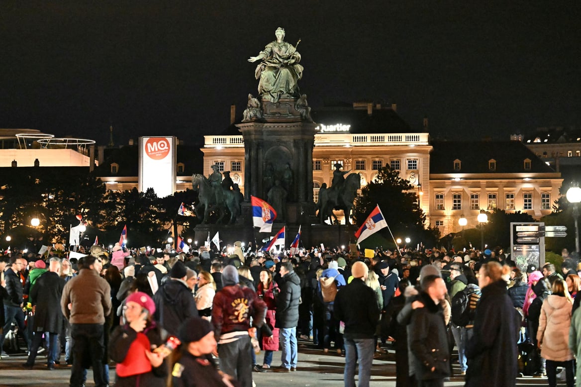 A wide shot of demonstrators in Vienna at night.