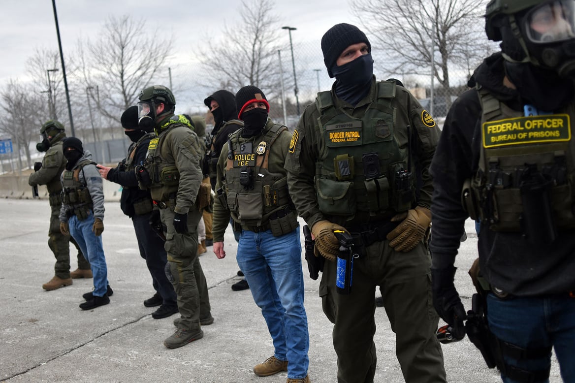 Federal law enforcement agents confront anti-ICE protesters during a demonstration outside the Bishop Whipple Federal Building in Minneapolis, January 15, 2026. (Getty/Octavio Jones/AFP)