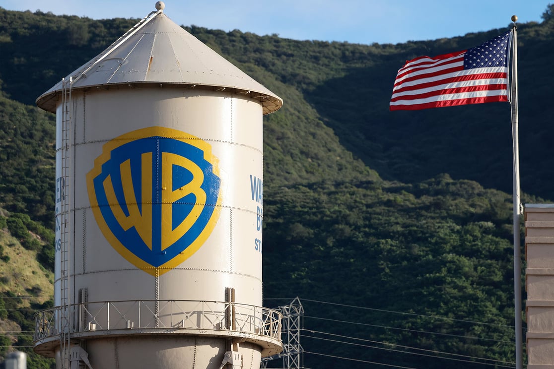 The Warner Bros. logo is displayed on the water tower at Warner Bros. Studio as an American flag flies on February 27, 2026, in Burbank, California. (Getty/Mario Tama)