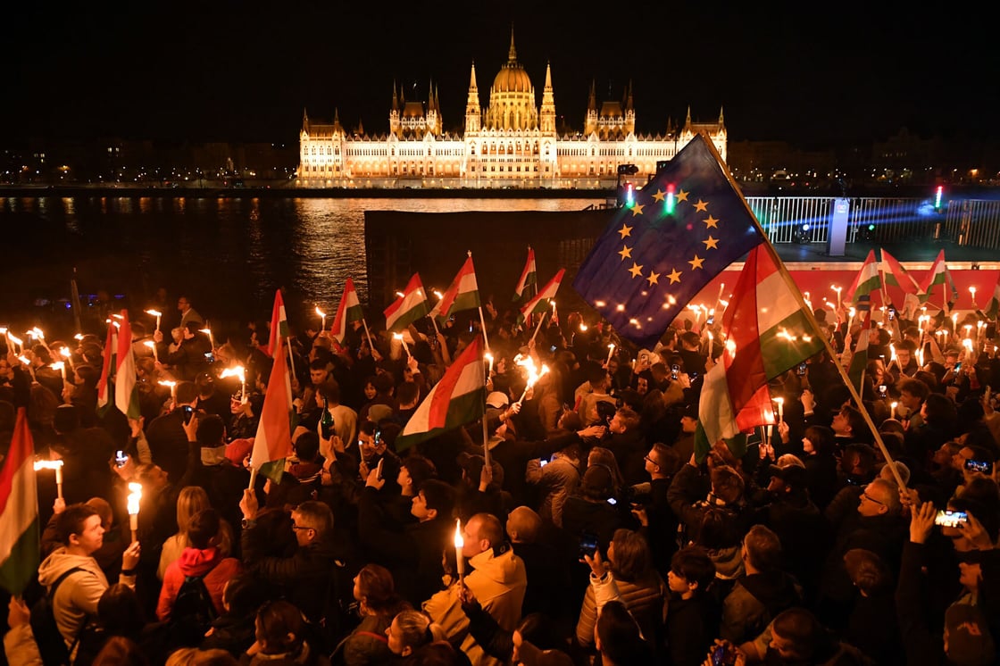 Supporters celebrate during election night on the banks on the river, April 2026. (Getty/Ferenc Isza)