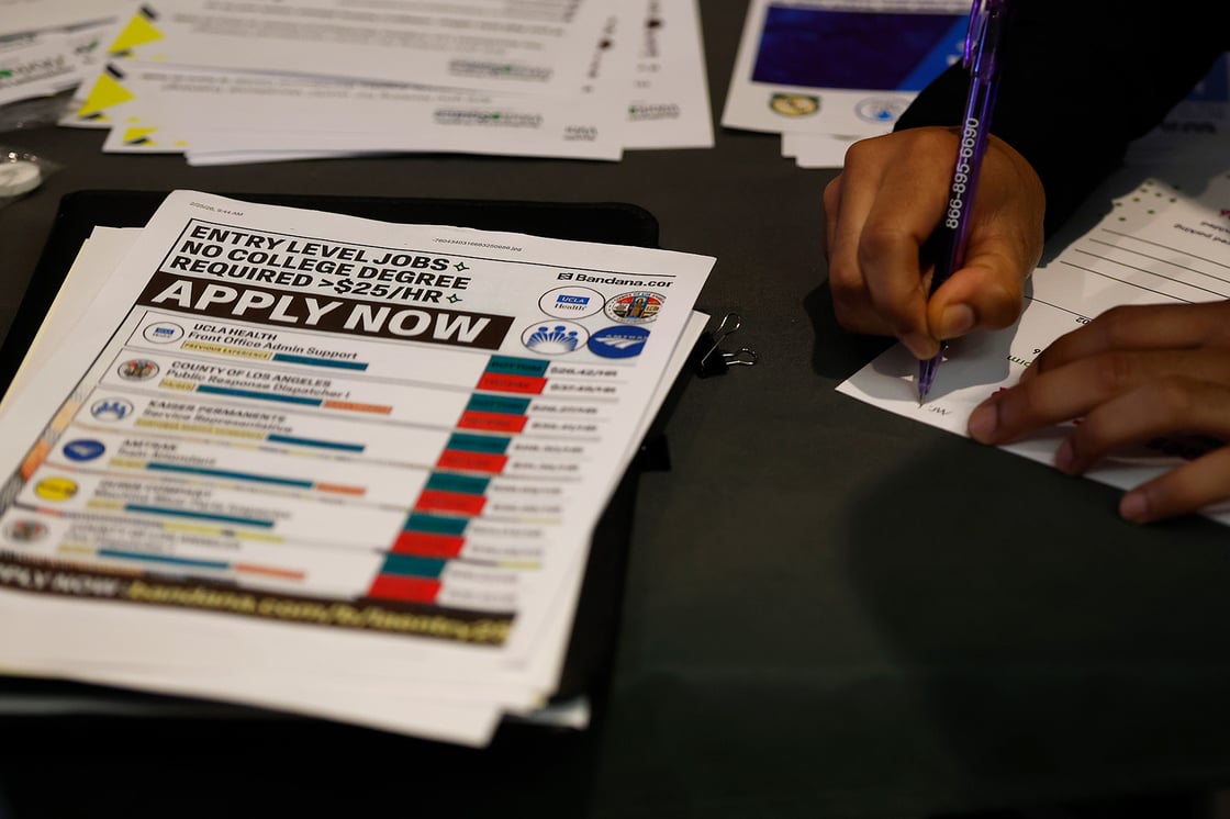 A job seeker fills out an application during a hiring expo on April 28, 2026, in Inglewood, California. (Getty/Justin Sullivan)